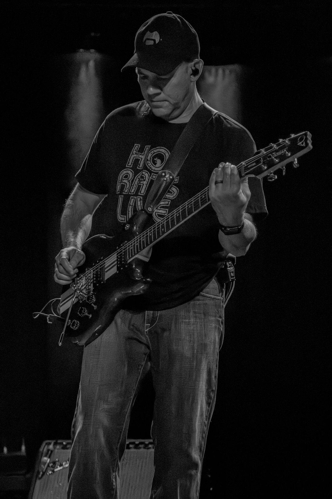 Little Moses Jones guitarist performing at a club show
