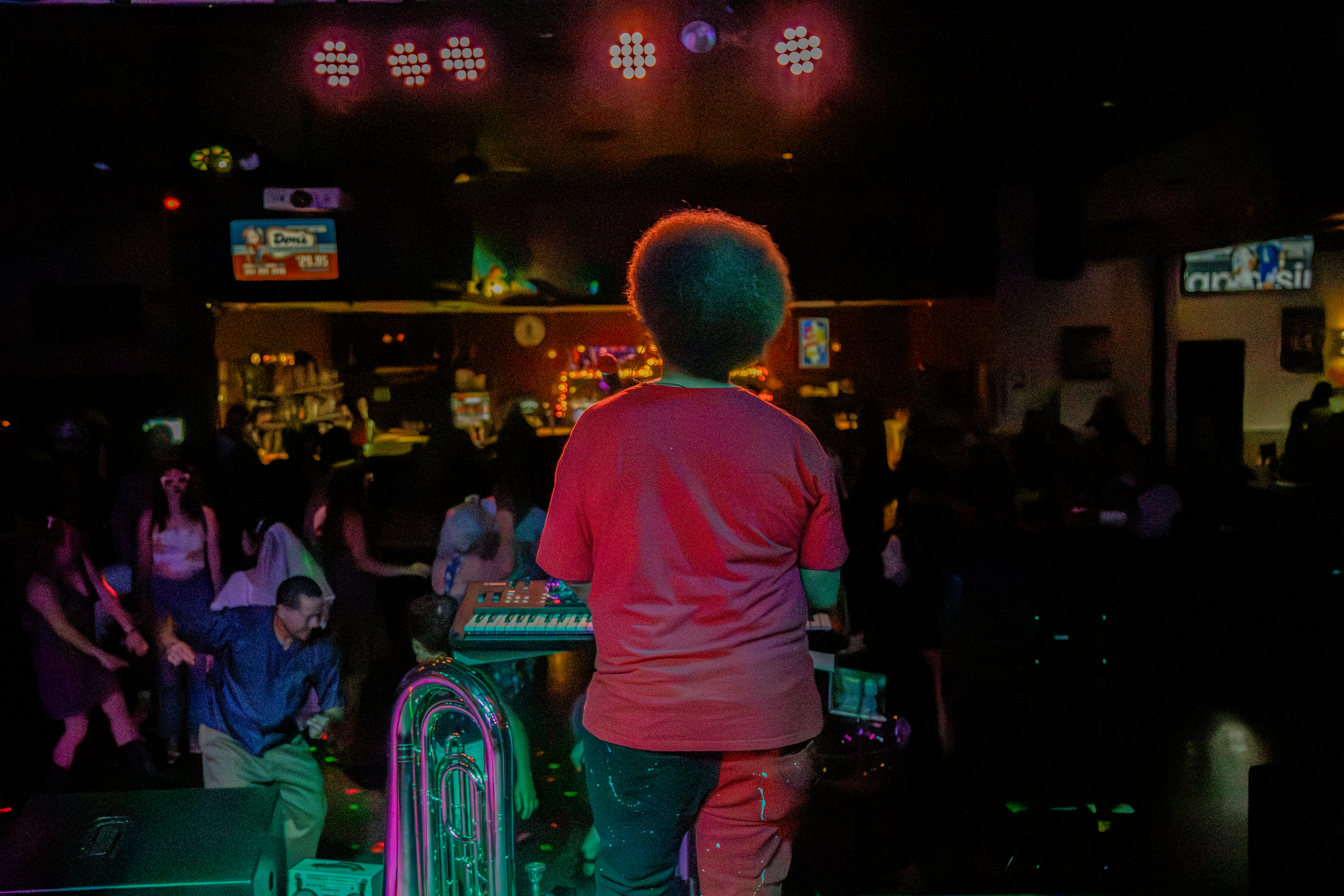 Little Moses Jones performing live with a packed dance floor at a casino venue